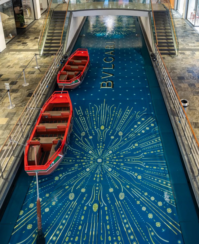 The Shoppes at Marina Bay Sands with its indoor canal, red gondolas and the BVLGARI name spelled in gold across the canal floor